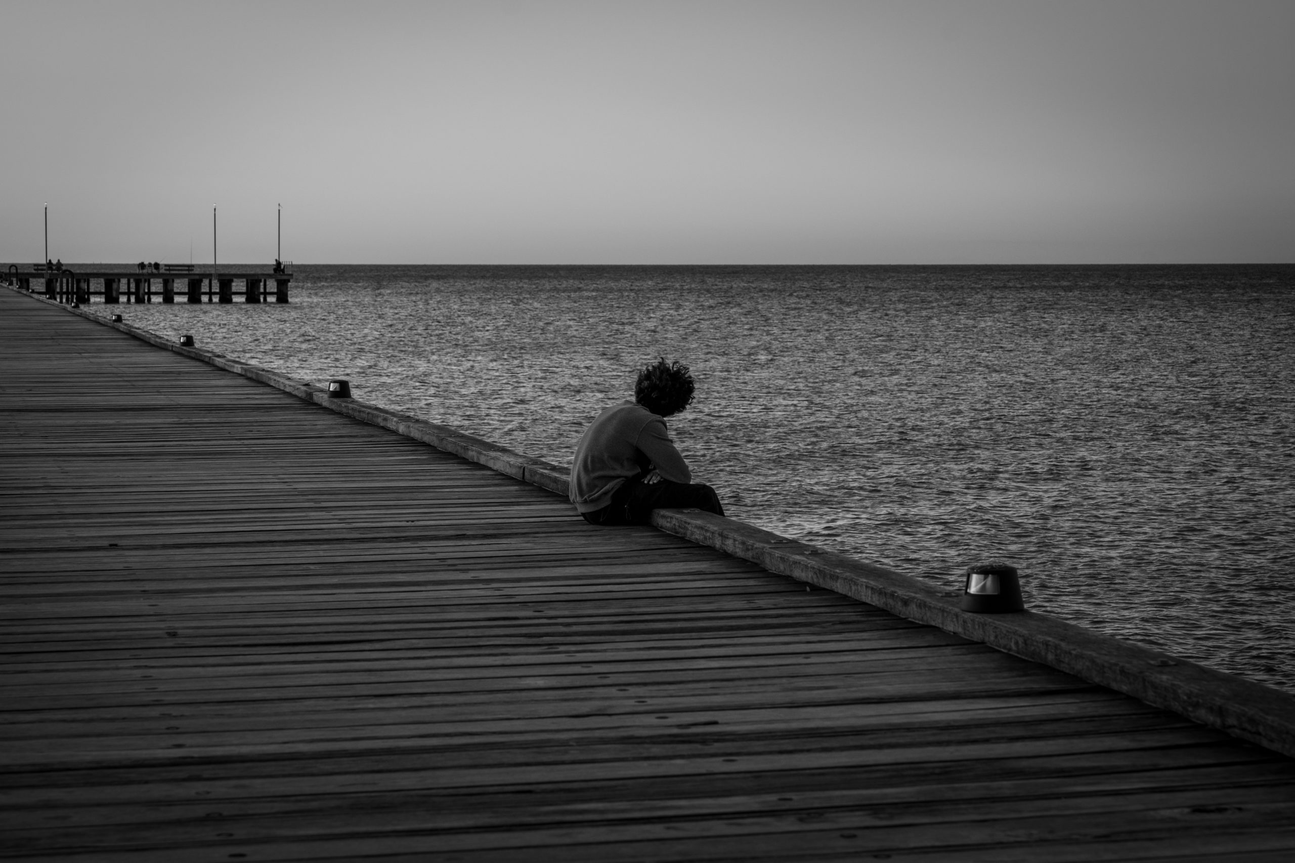 Boy On A Pier